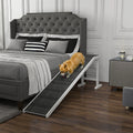 Dog using a dog ramp and dog stairs alternative to climb onto a bed in a bedroom setting | WagWondersPro Voyager