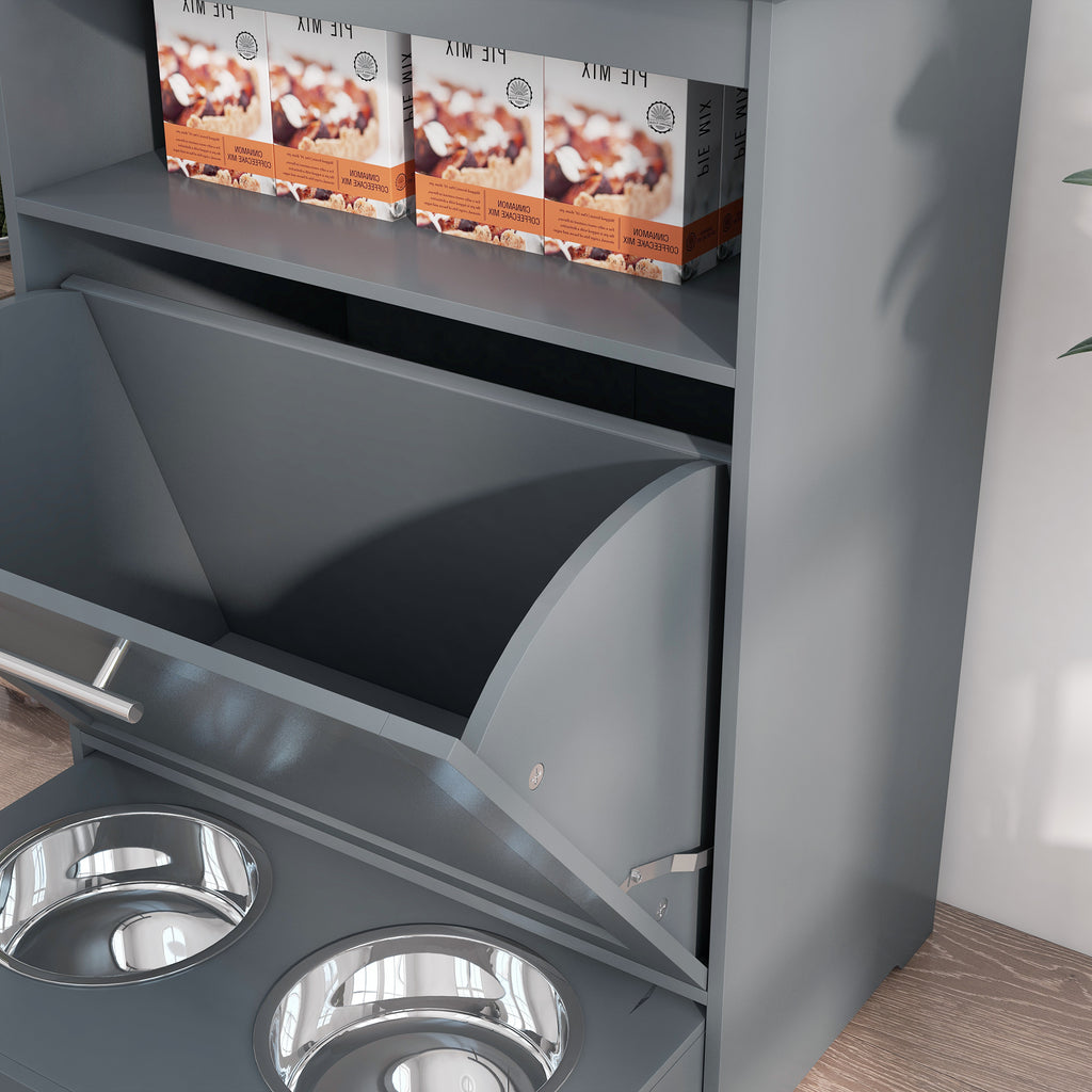 Gray pet feeder with two stainless steel bowls and two boxes on a shelf.