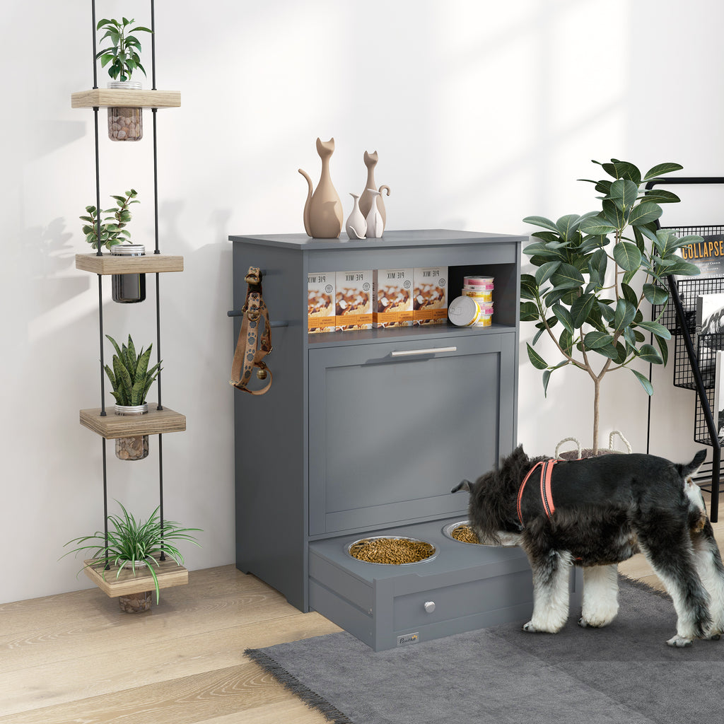 Gray elevated pet feeder with a dog eating, plants, and decor in the background.